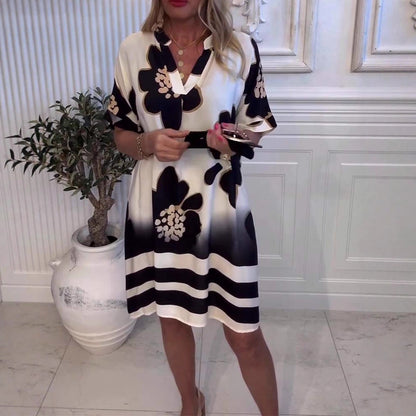 Derin V yakalı ve desenli kadın bol elbise