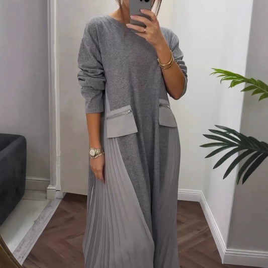 Yuvarlak yakalı ve cepli, kadınların günlük pilili elbisesi